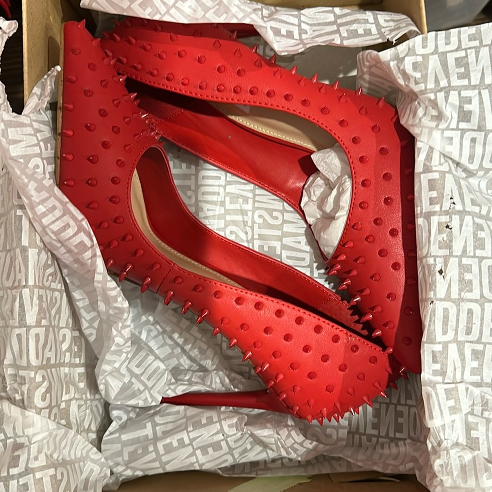 Steven Madden size 8 1/2 red spiked pumps never been worn. Brand new in box.